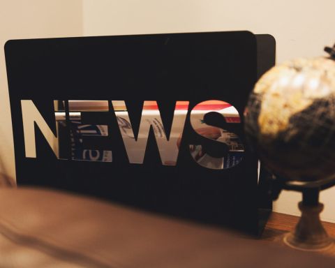 Detail of Herrenzimmer on a sideboard is a stand with large letters NEWS next to it is an old globe