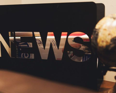 Detail of Herrenzimmer on a sideboard is a stand with large letters NEWS next to it is an old globe