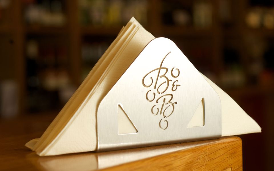 Napkins in napkin holder with the logo of the Biegler & Brand winery in the Kaisergarten Weinrestaurant & Vinothek in Alzey